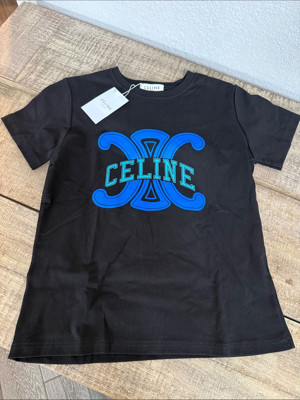 Women’s Cel  Black Stretch Tee with Blue & Green Emblem